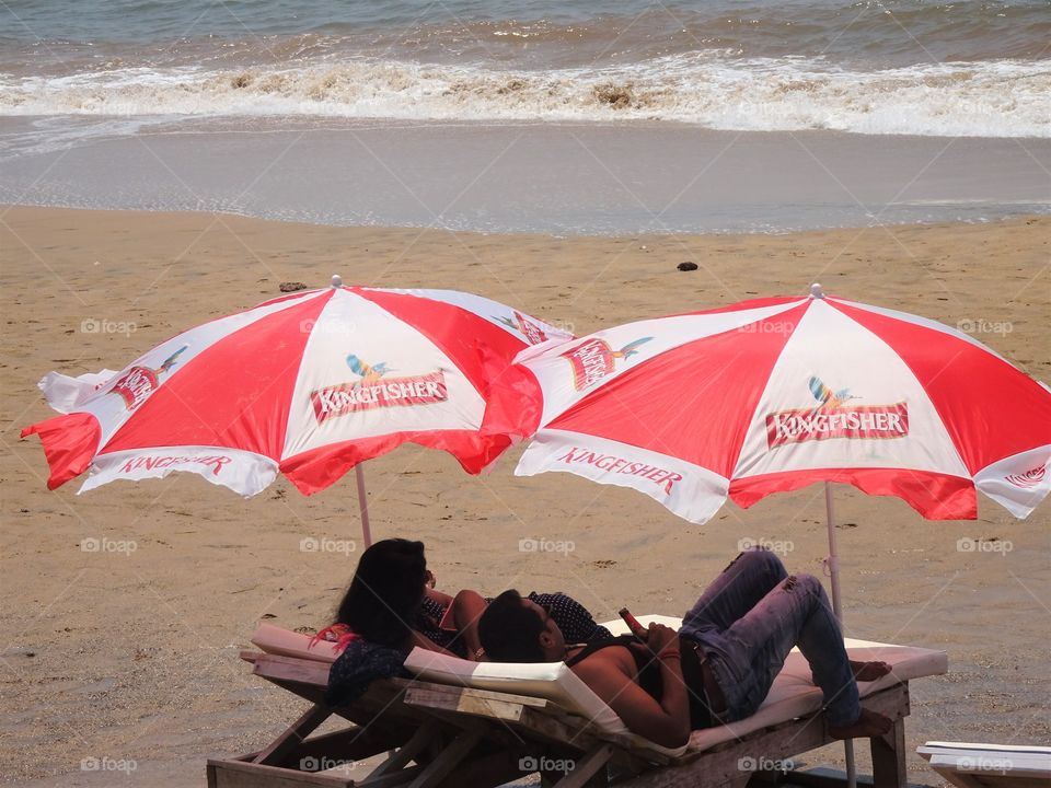 under the shade...by the beach...