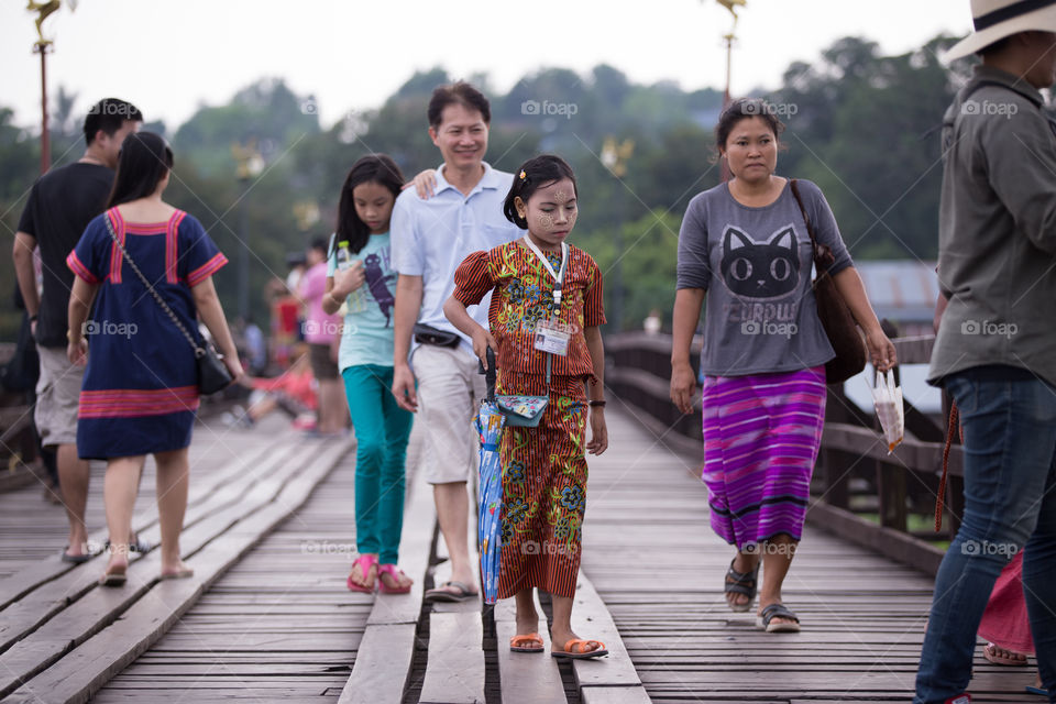 Myanmar children on the wood bridge in Sagklaburi Kanchanaburi Thailand 