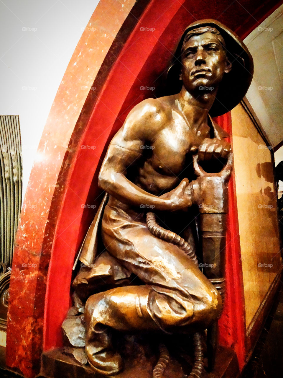 Moscow subway.  "Revolution square".  Young miner