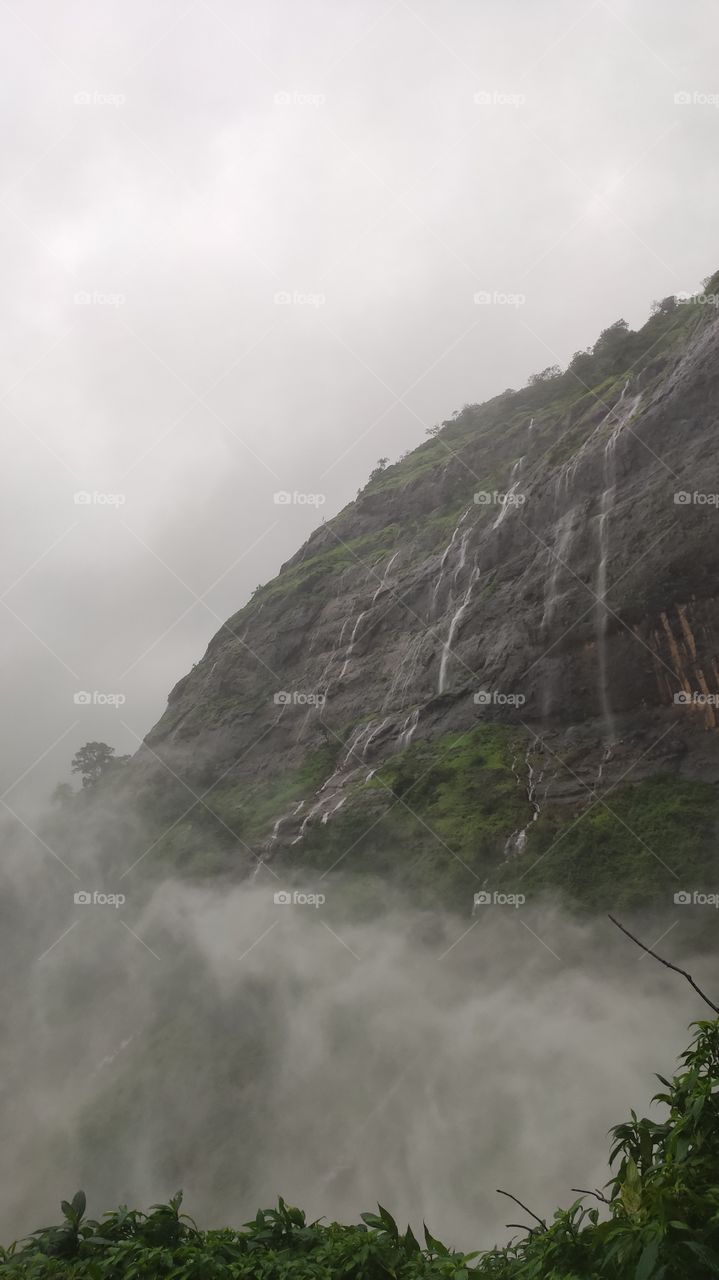 Mountains arrested by clouds, wind and water in amalgam creating clouds and to  witness this in your very presence was out of this world experience. Down in valley still above the clouds,in the clouds and clouds are above us, was happily stunned.