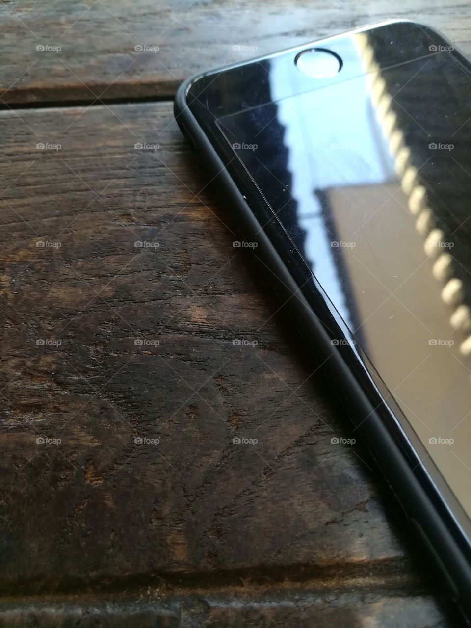 mobile phone on wood table