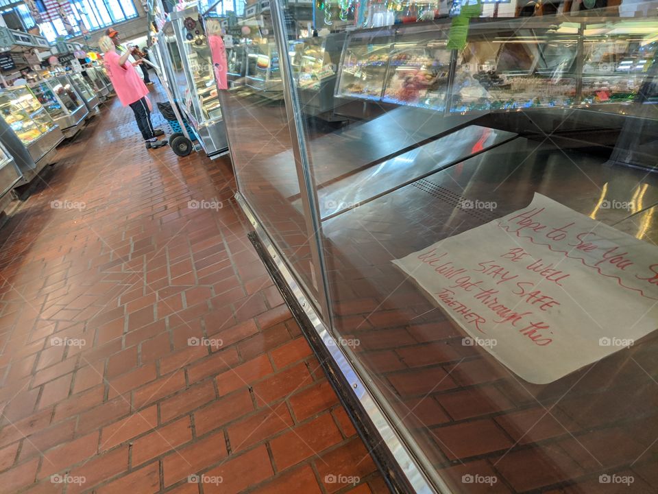 a closed stand at Cleveland's West Side Market wishing patrons well while they are away.