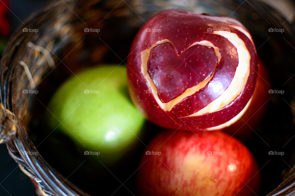 Basket of apples with heart shaped