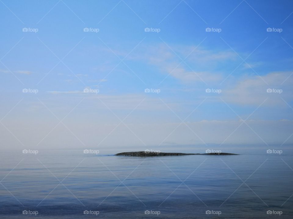 Rock in a middle of water. Superior lake, Ontario, Canada