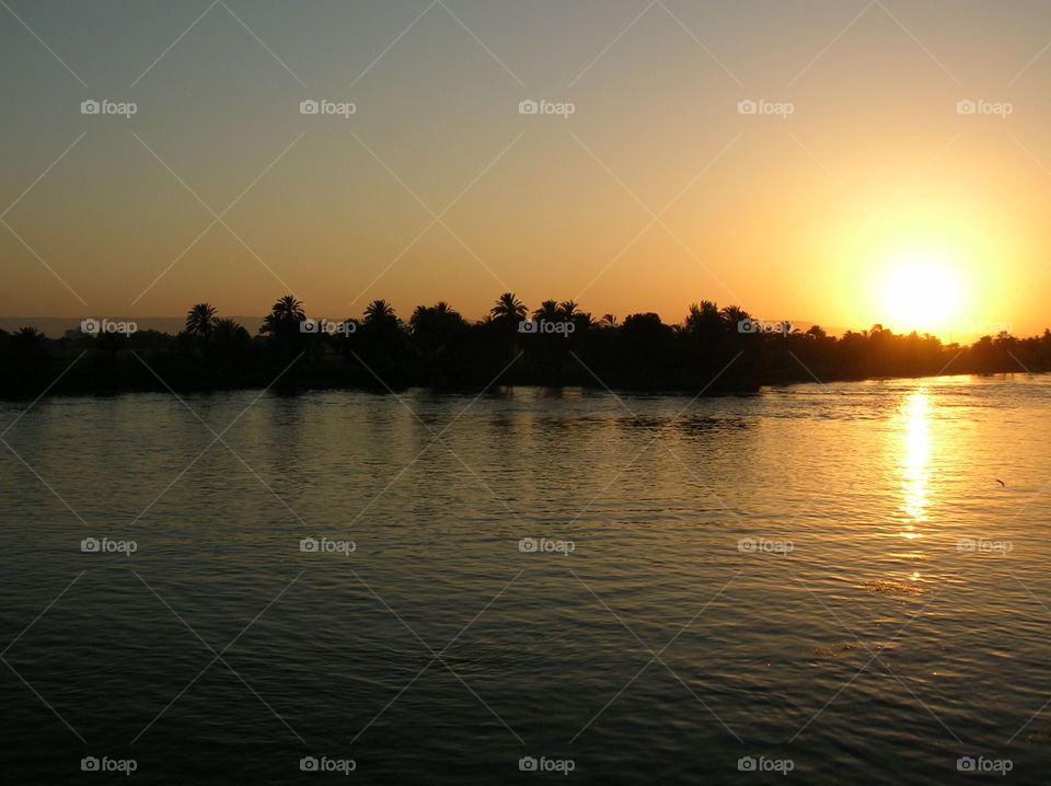 Sun going down on the Nile River