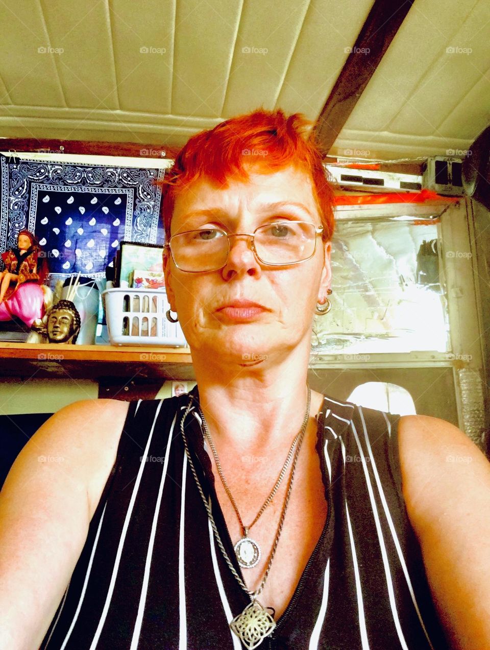 Elegantly dressed in a black & white vertical stripe motif I am trying to stay cool for the summer sans air conditioning aboard „Salvation“, our „28 foot 1969 Luhrs“ cabin cruiser. Staying as still as possible is the idea. 2019. Hypnotic Productions