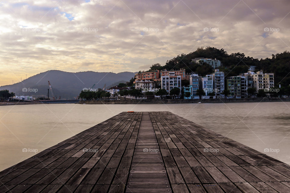 Wooden Dock Look over the Man made Lake and the other side of the city.
