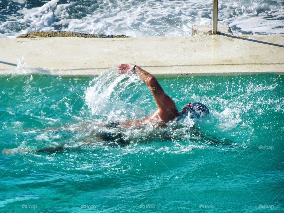 Portrait of a serious swimmer in the pool