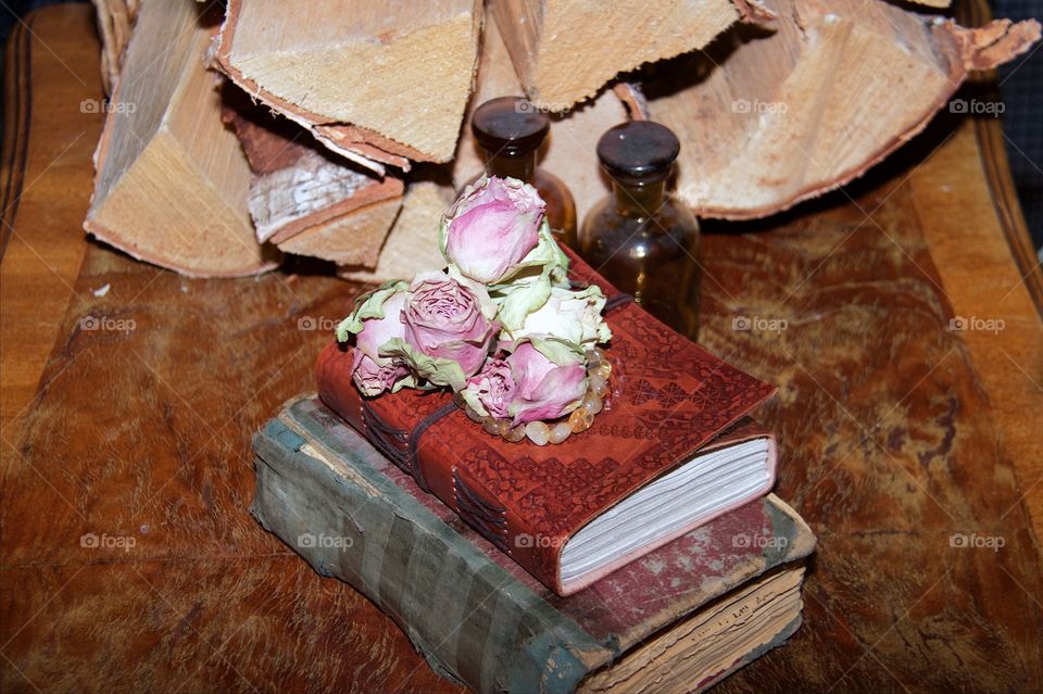 Old book and dried roses 