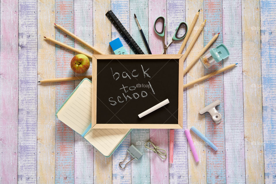 A chalkboard with back-to-school supplies 