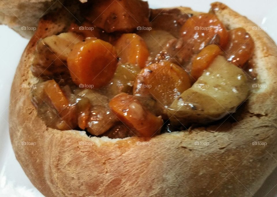Blow braised beef stew served in a bread bowl.