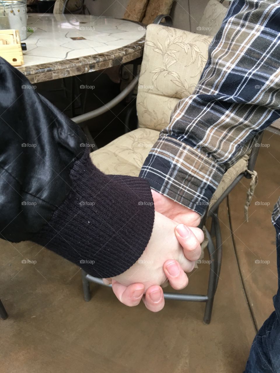 Young couple holding hands