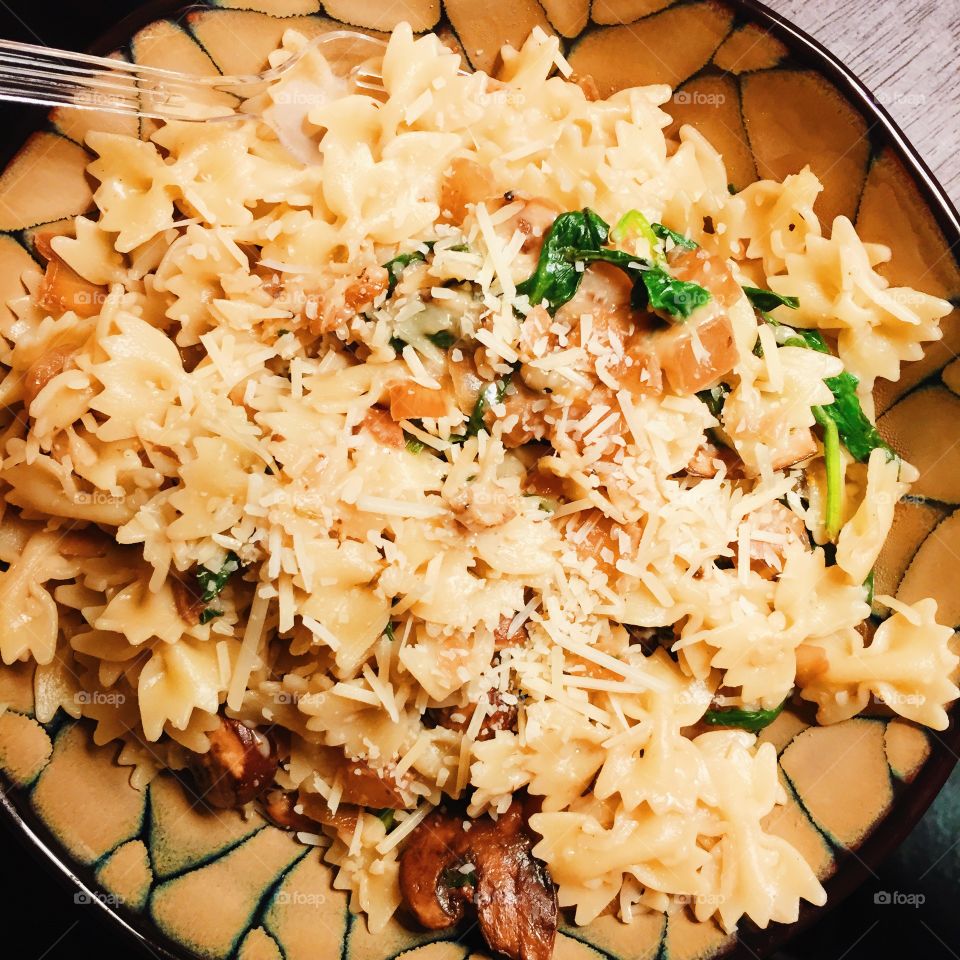 Mushroom Spinach Pasta. My dinner of mushroom spinach pasta topped with Parmesan cheese 