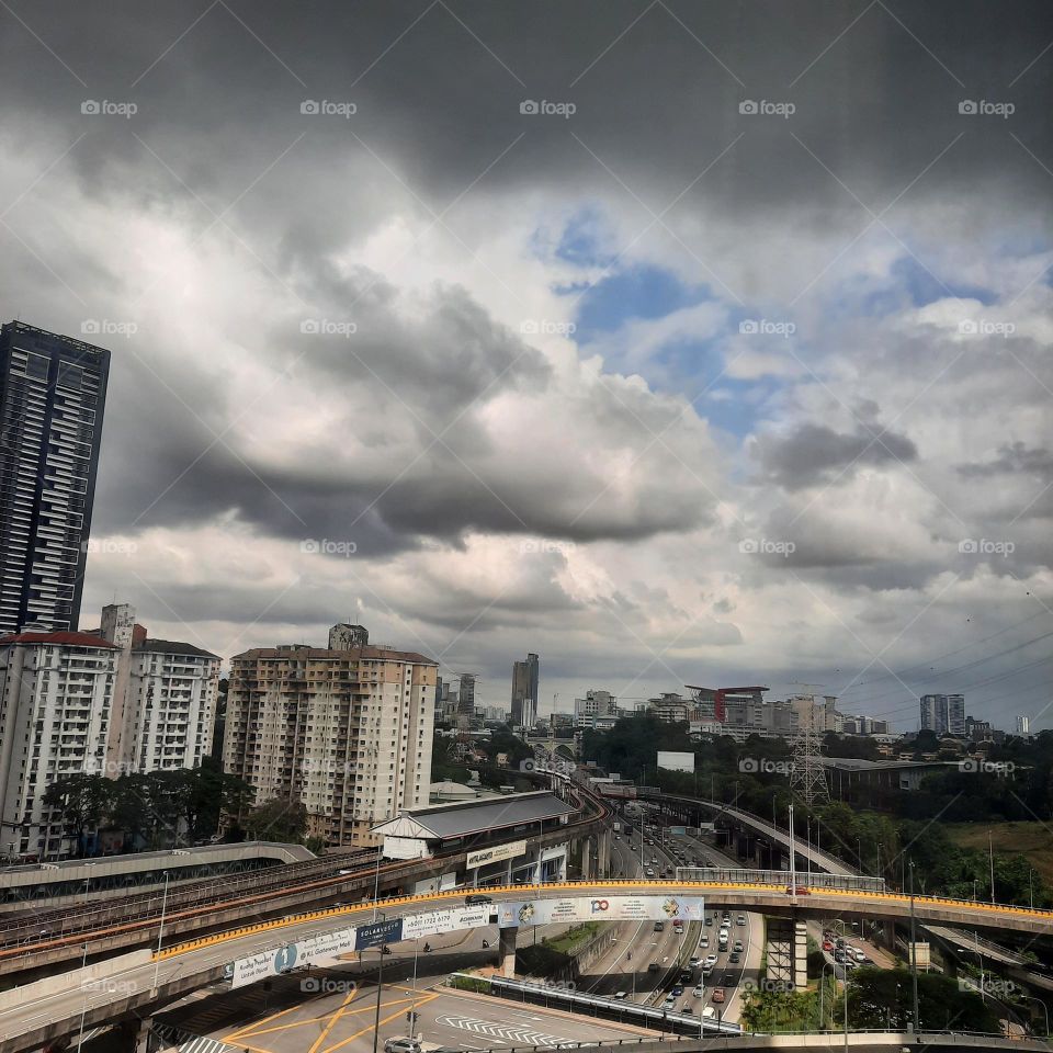 city highway cars dark rain sky cloud