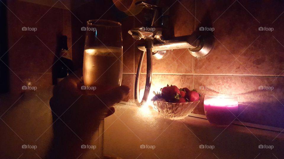 Romantic evening, dinner, champagne, strawberry, fruit, bath