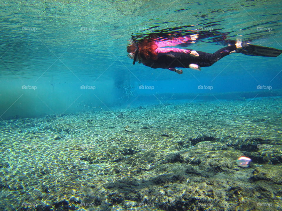snorkeler in clear waters