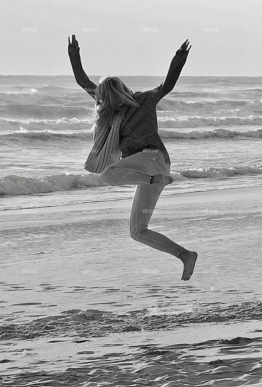 Foot loose and fancy free - like the wind. This young lady was thrilled to walk on the white sandy beach in front of the Gulf if Mexico