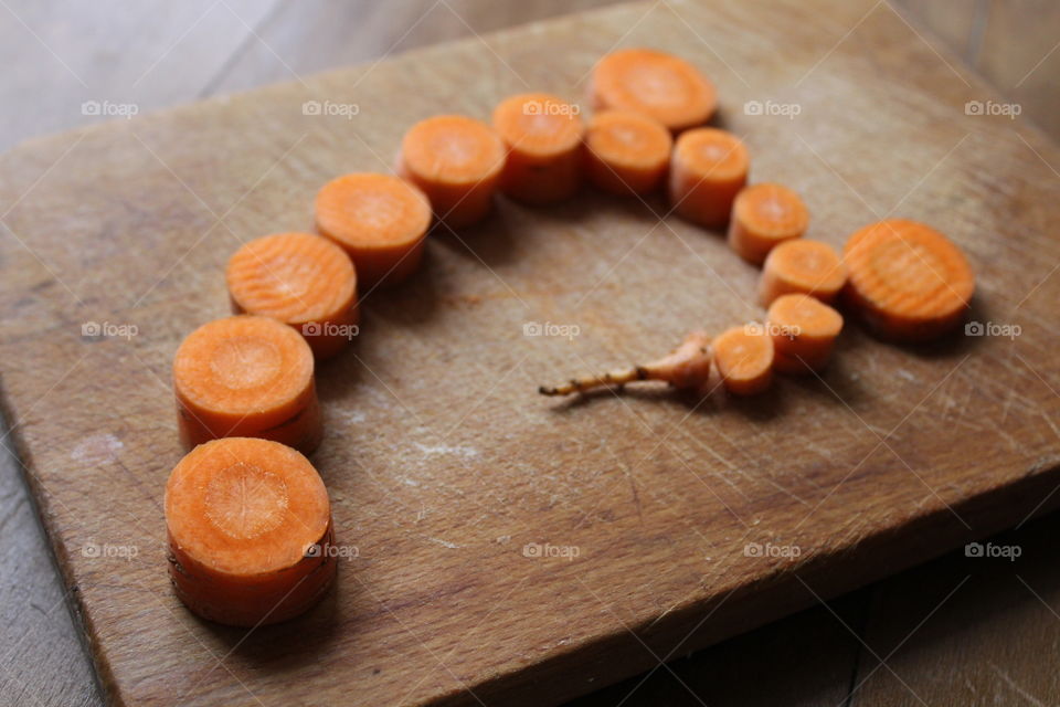 cut carrot on wooden table