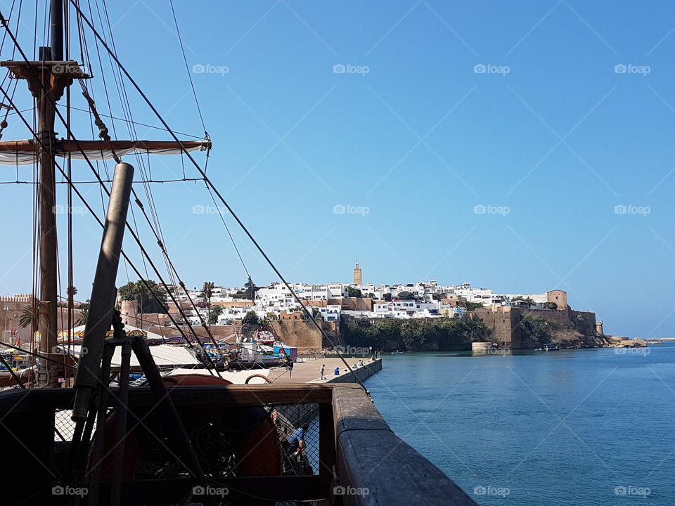 Morocco Moroccan beach sea Morocco blue sky buildings mosque city clouds sky skys cloud view of the old city