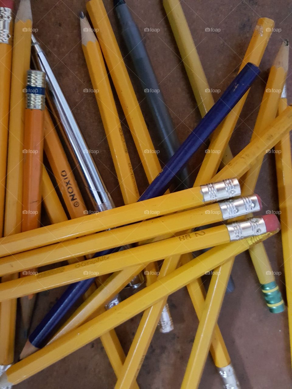 pencils scattered on a desk