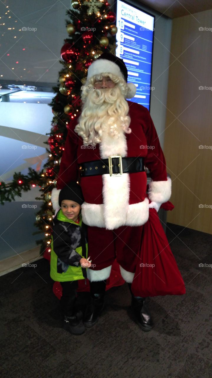 my boy and santa at the airport yeg