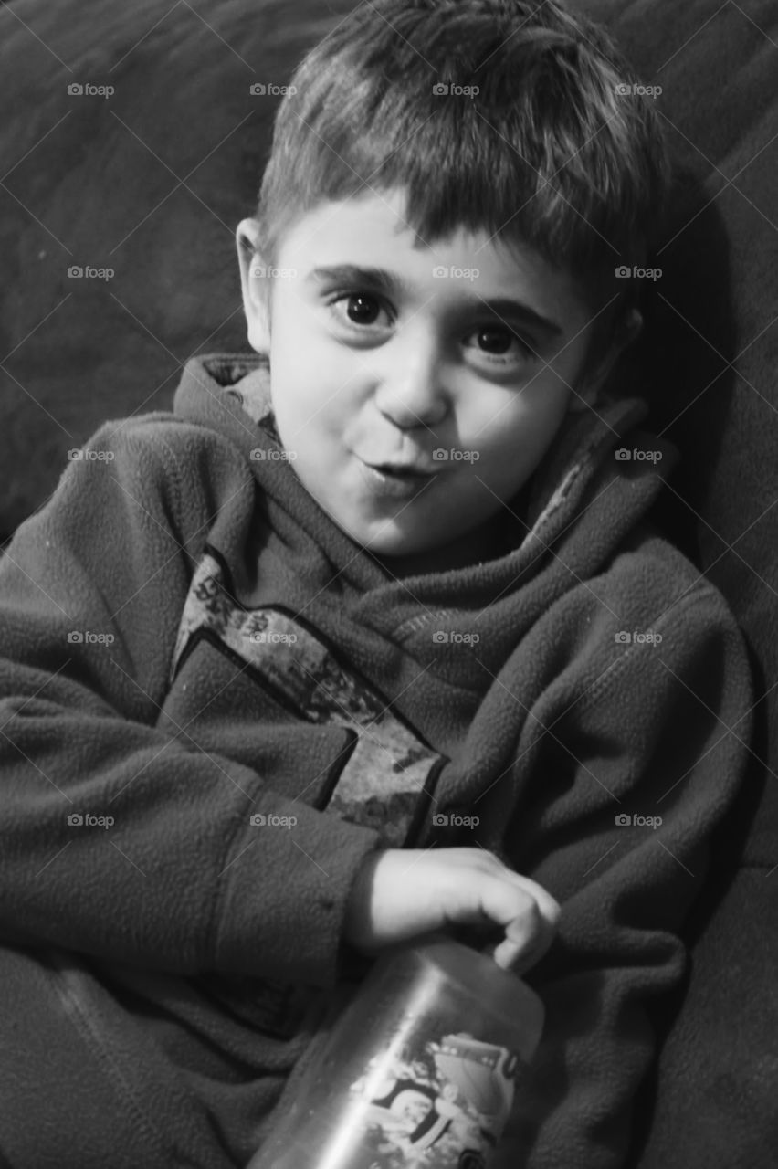 portrait. Cute boy sitting in the living room