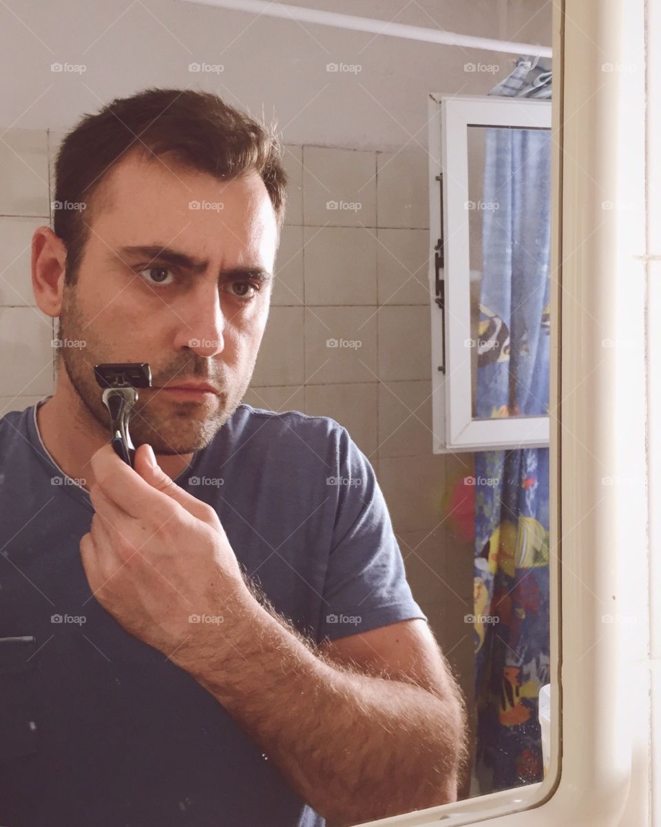 Close-up of a man shaving