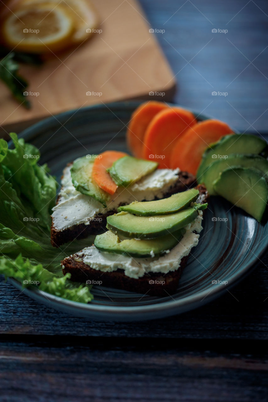 Dietary sandwiches with grain bread, cream cheese and avocado