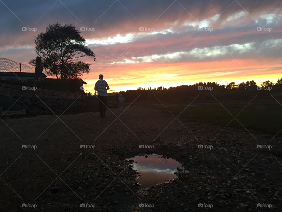 Silhouette of man on the beach at sunset