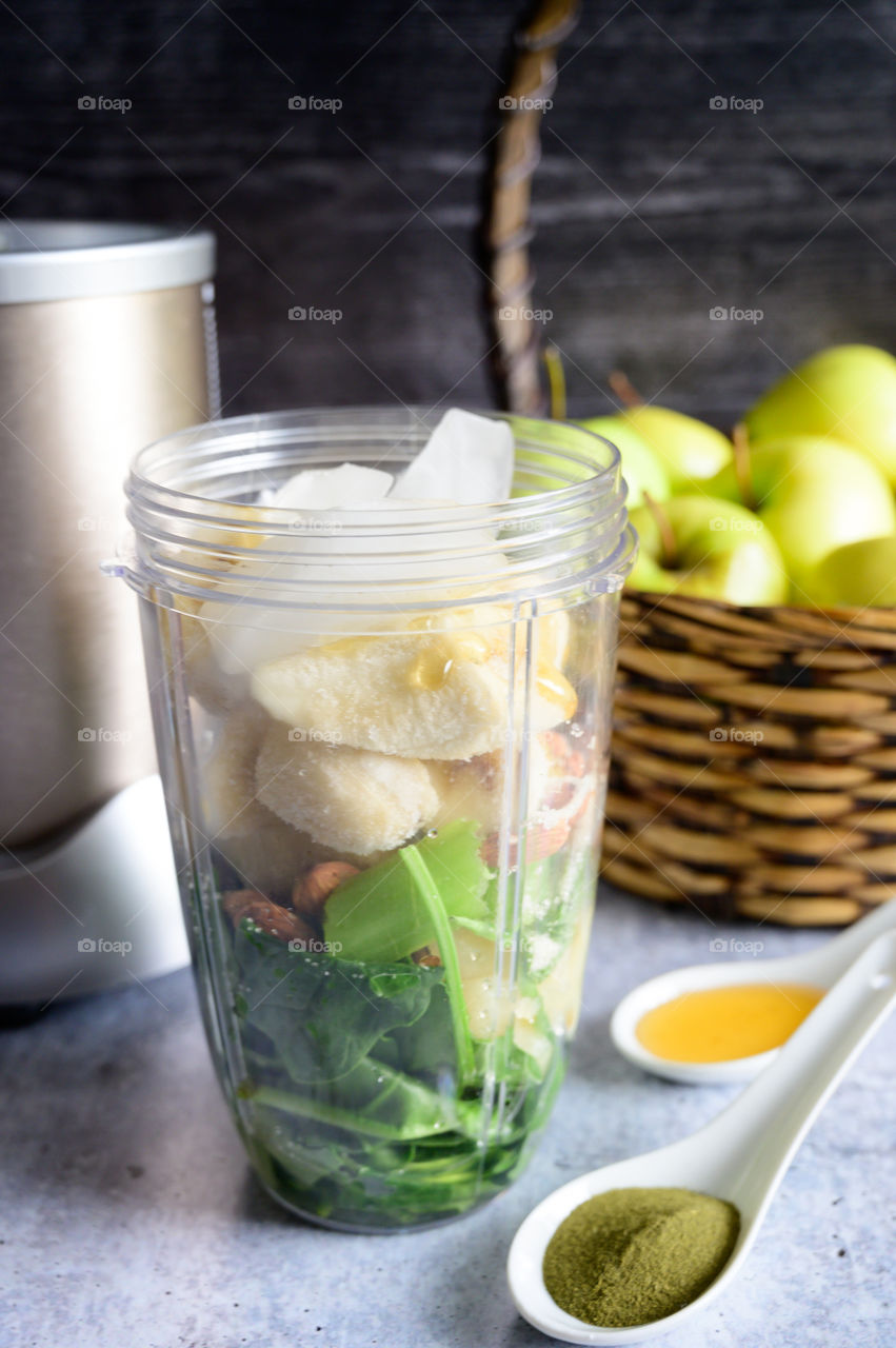 Drink your healthy greens for breakfast, power juice with spinach, celery, banana, almonds, honey, Matcha powder for super antioxidant healthy drink