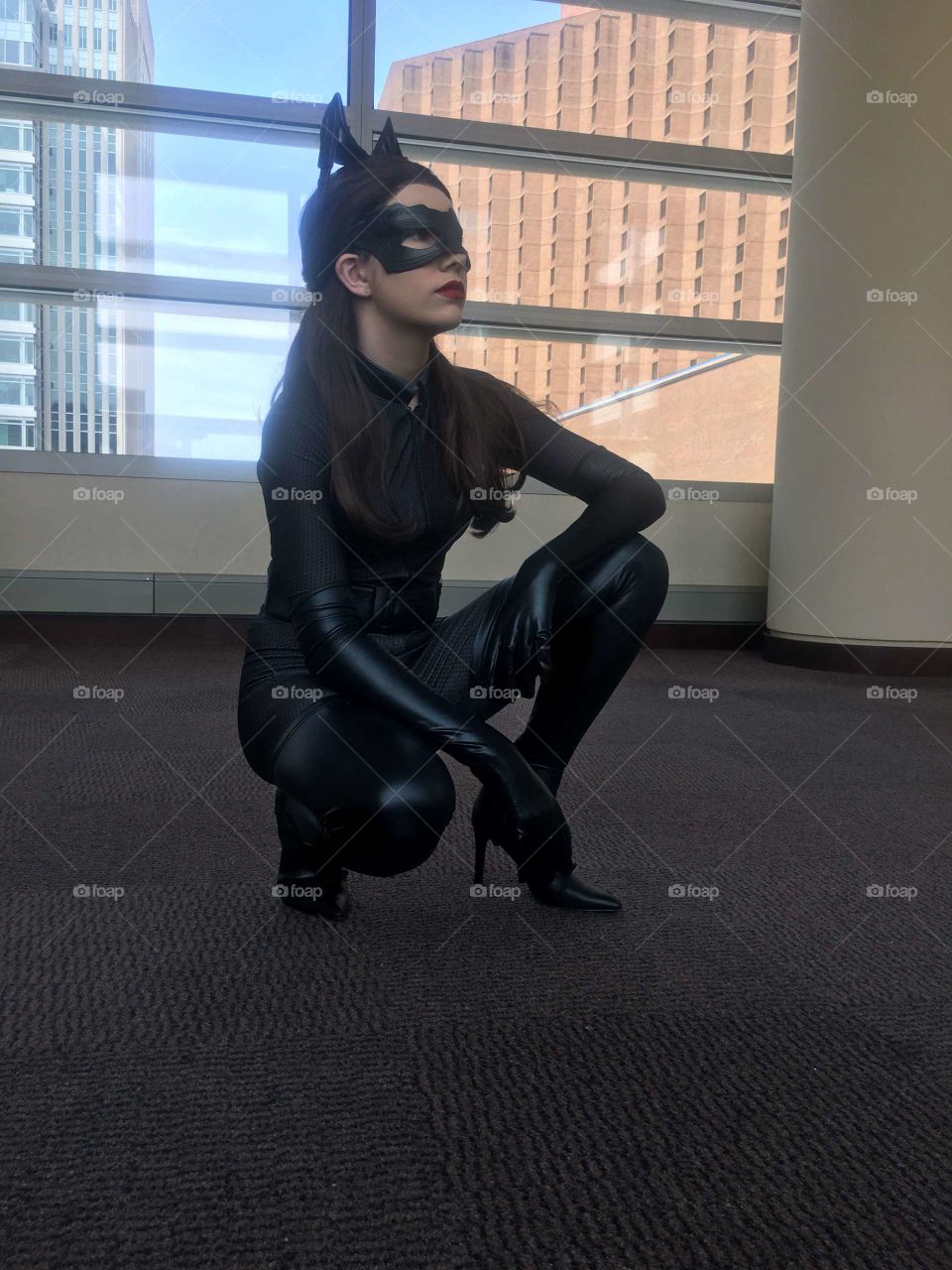A beautiful young woman cosplaying as Catwoman
