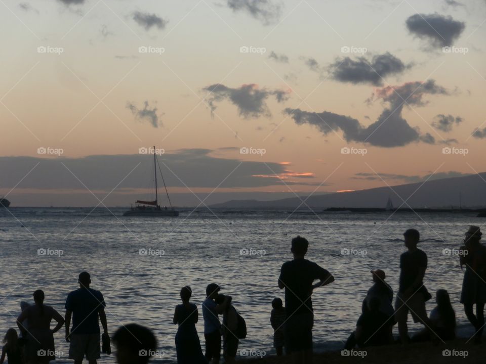 Waikiki beach sunset. Watching the sun go down on the beach