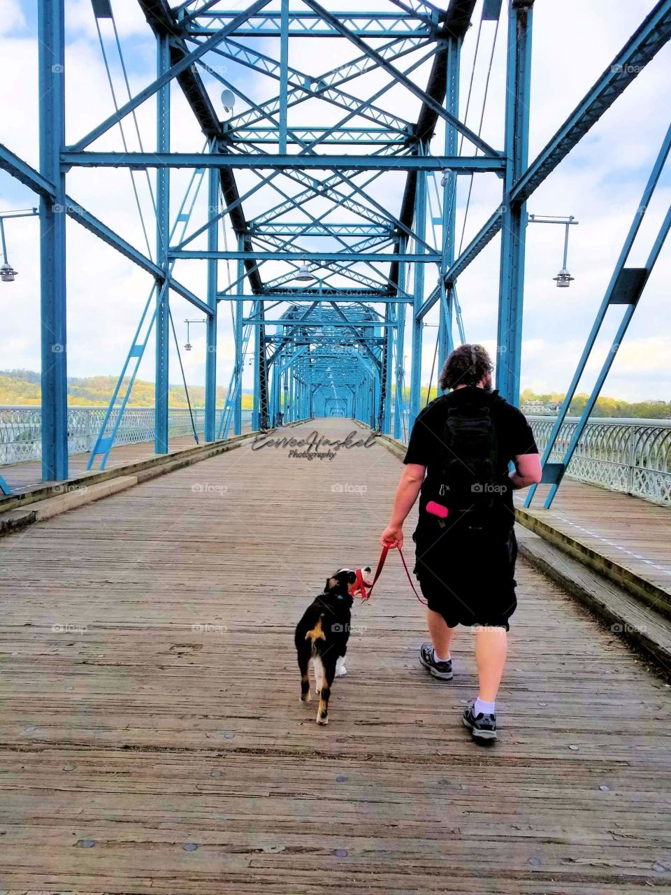 A walk down the Walnut Bridge with his best friend.