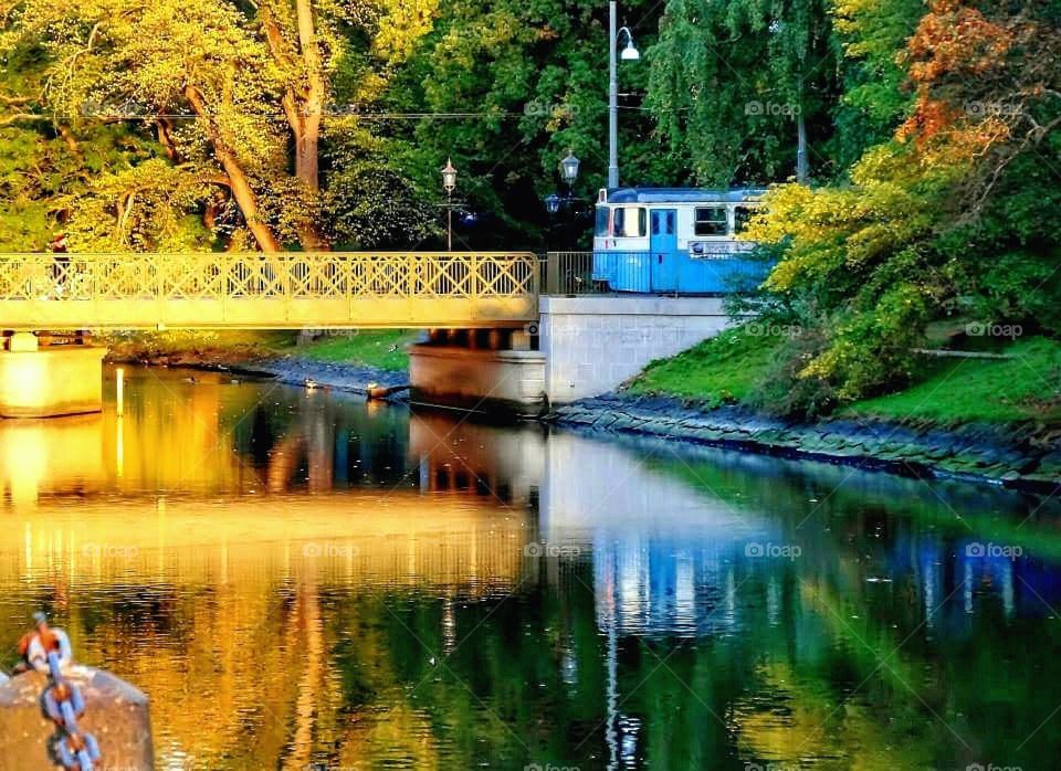 Tram and bridge in the evening sun