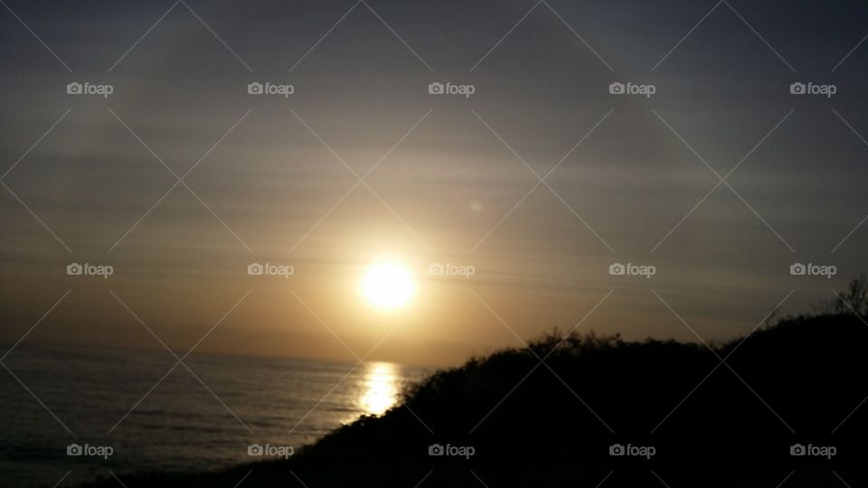 sunrise in Australia with mountain silhouette.