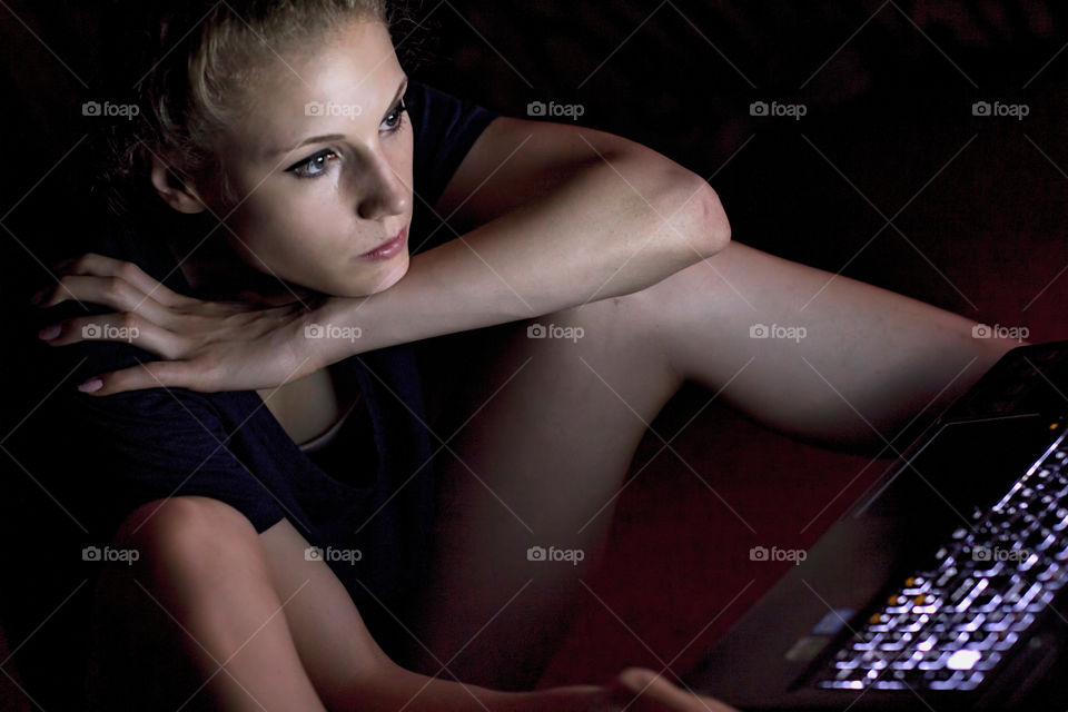 Close-up of a beautiful woman using laptop