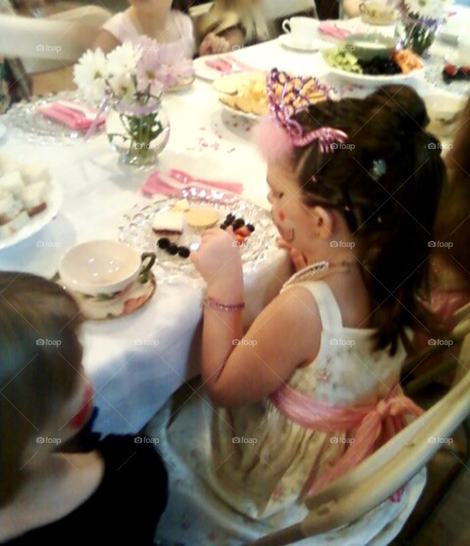 Little Girl dressed as a princess at an elegant tea party