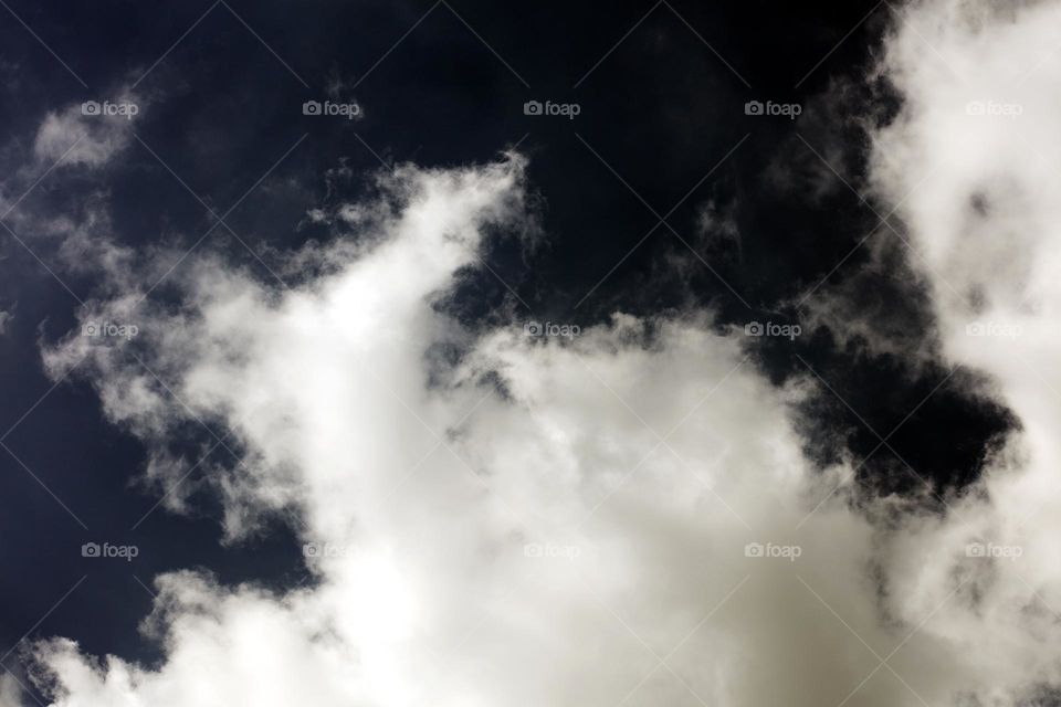 Black sky with clouds trippy psychedelic minimalistic background winter season daydreaming