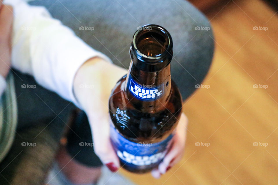 Bud Light- holding a bud.