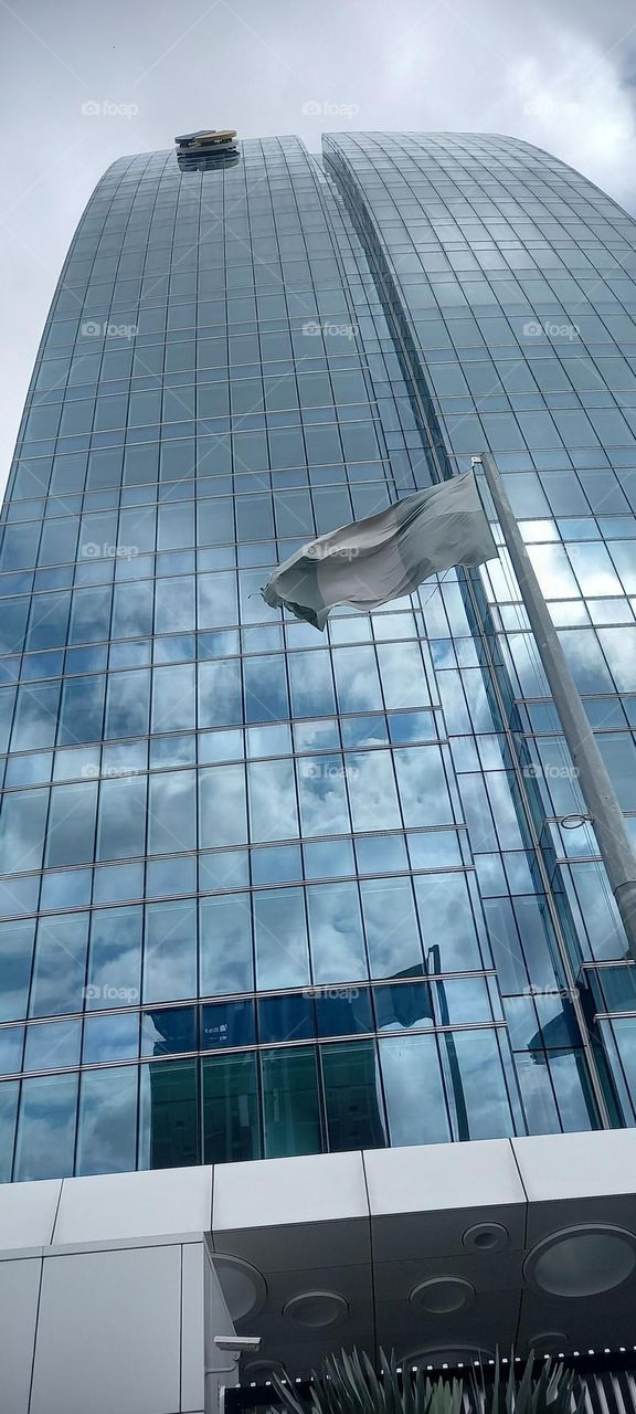 urban glass skyscraper reaching to the sky.This breathtaking view was captured on camera.