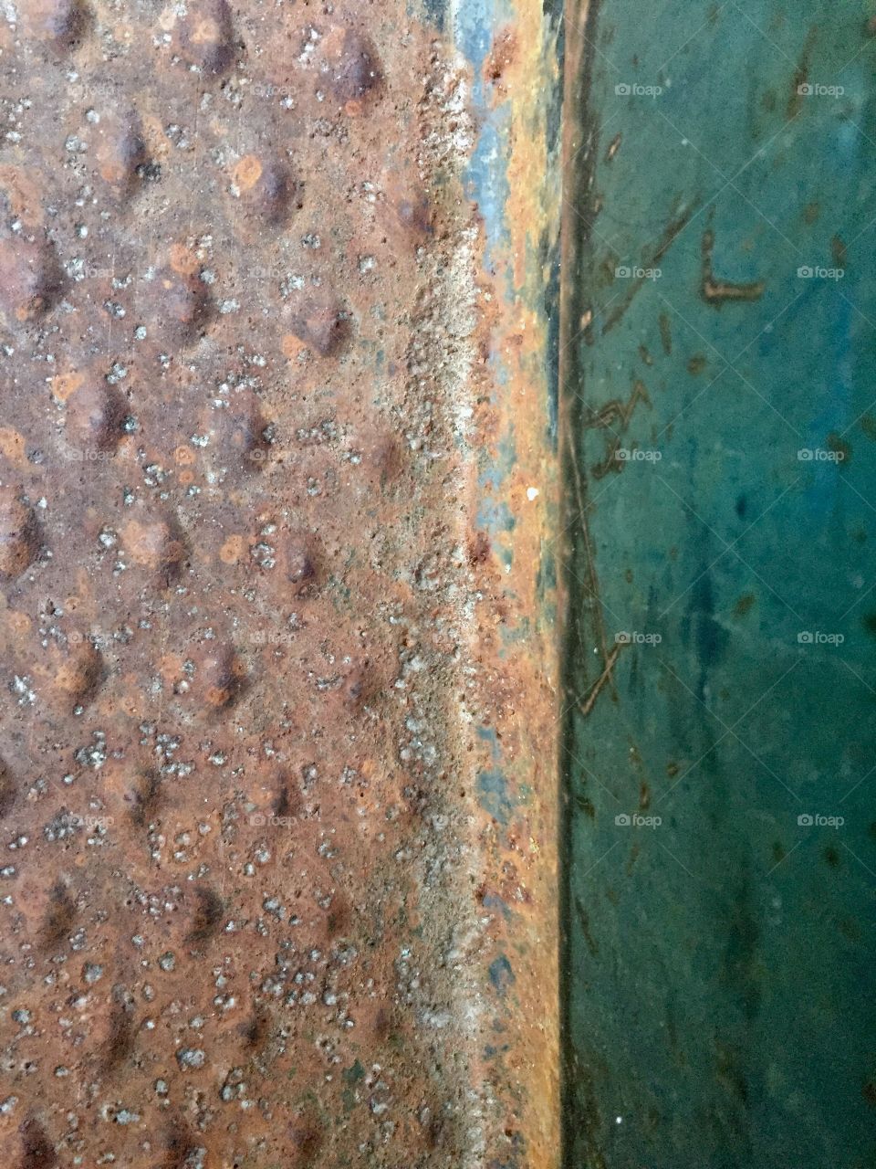 Overhead view of a diamond-plate running board and side door of a vintage truck