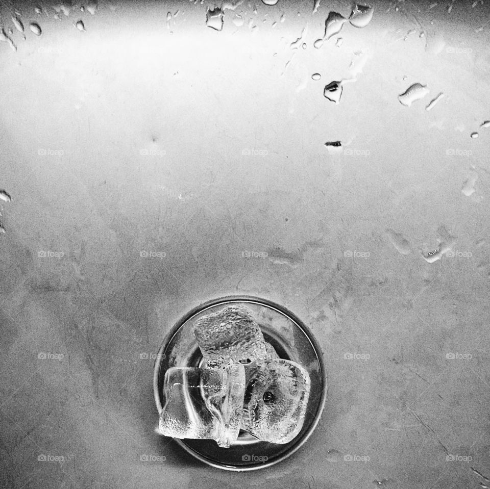 High angle view of ice cube in glass