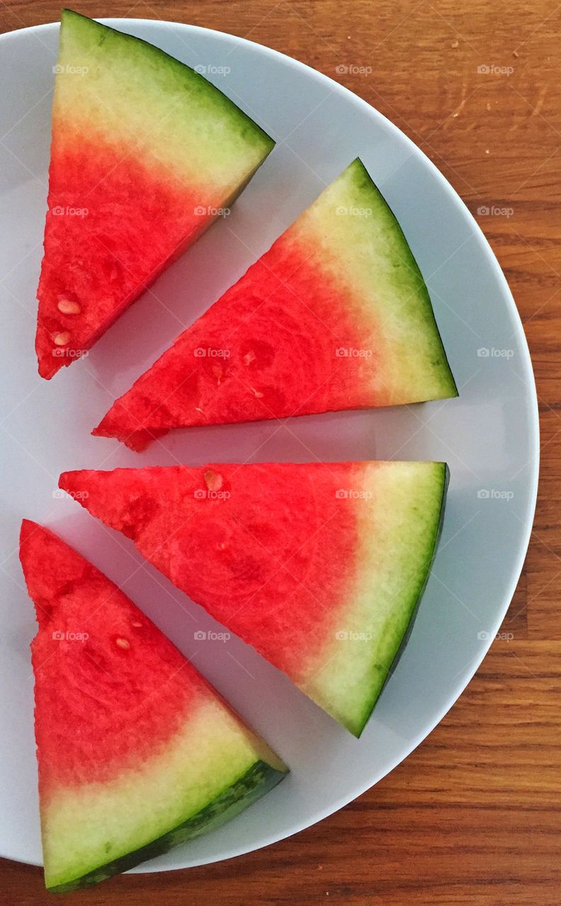 High angle view of sliced watermelon in plate