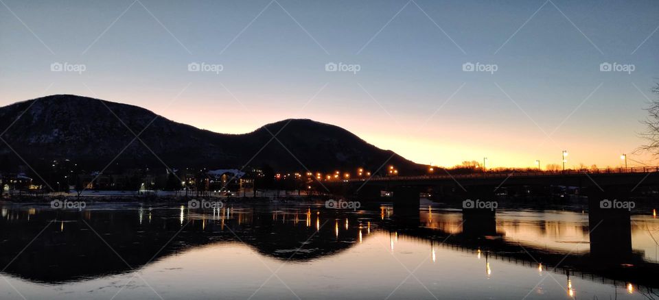 A new day, mountain, river and a bridge