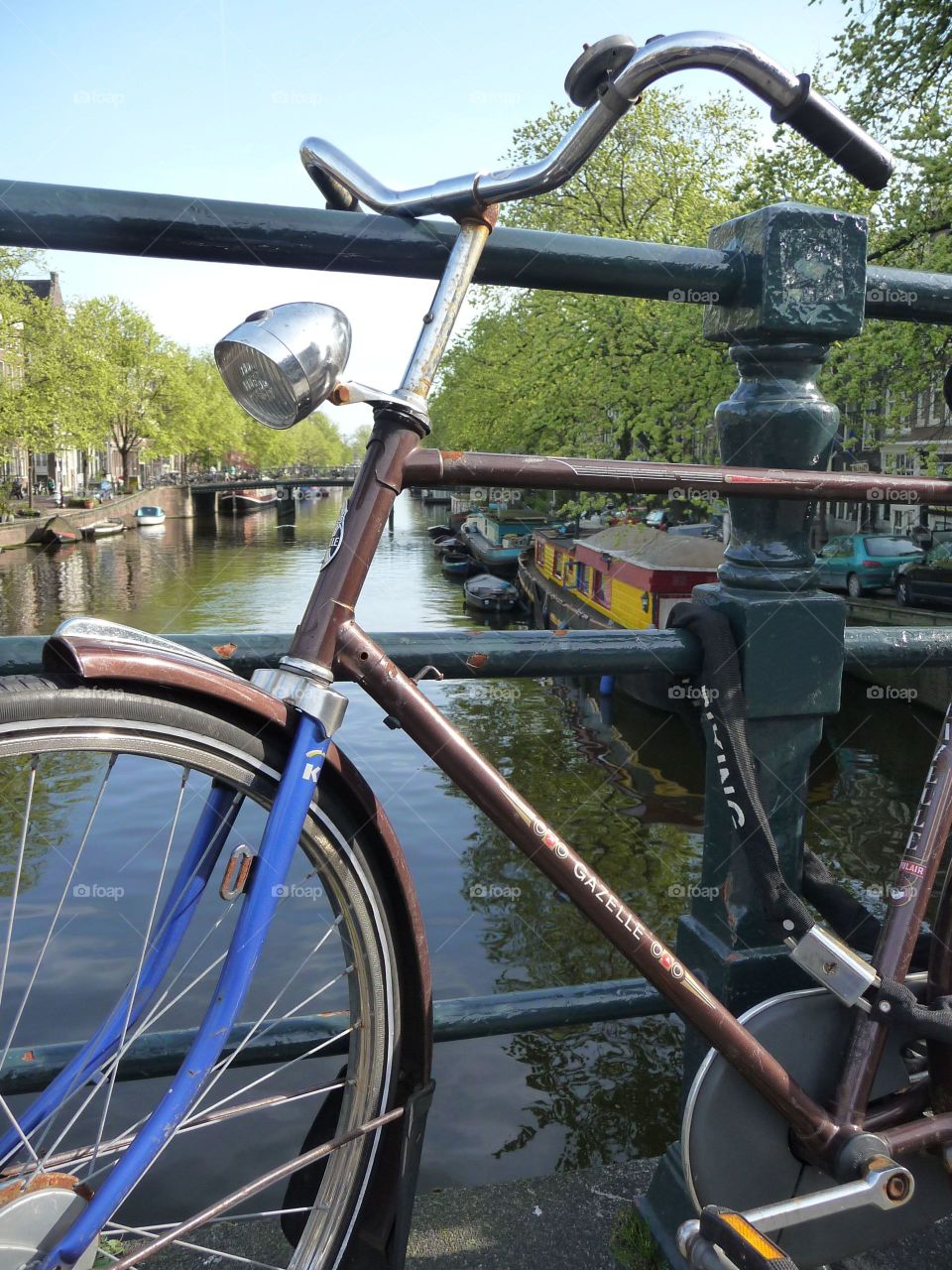 Ride a bicycle along the canals in Amsterdam. It's very relaxing to ride a bicycle along the beautiful canals of Amsterdam. Enjoying the summer sun, a coffee or a snack here and there and the warm wind in your hair.