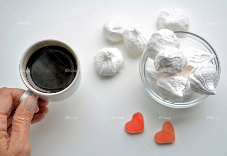 coffee cup with candy top view on a white background