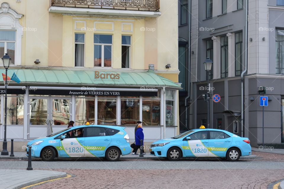 two blue taxis