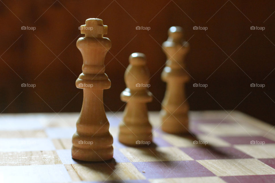 Close up of a few chess pieces