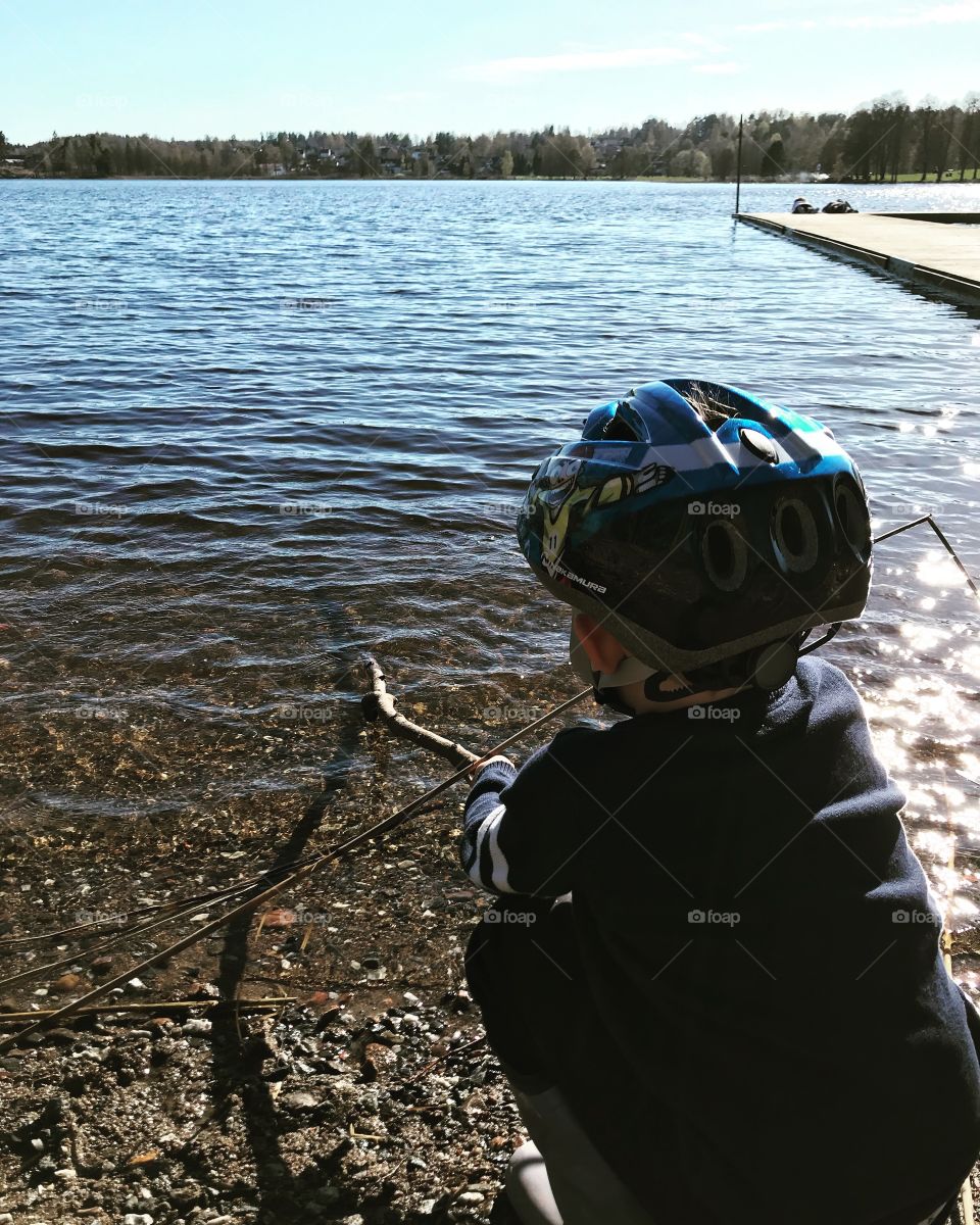 Beautiful day with my kid. He is ”fishing” in Karlskoga, Sweden. The lake is called Möckeln. 