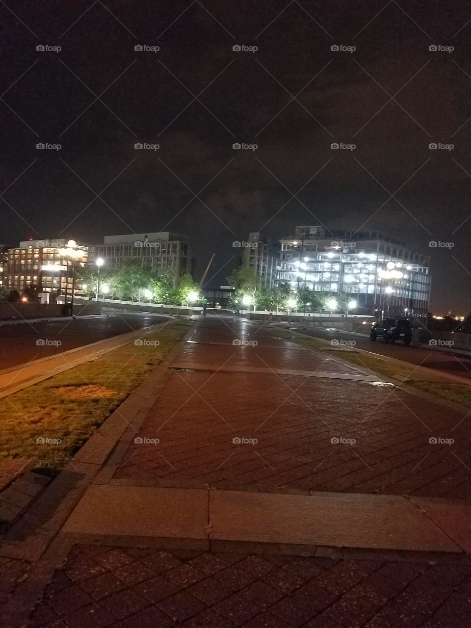 night shot of buildings by the Washington DC waterfront